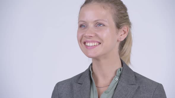 Face of Young Happy Blonde Businesswoman Thinking