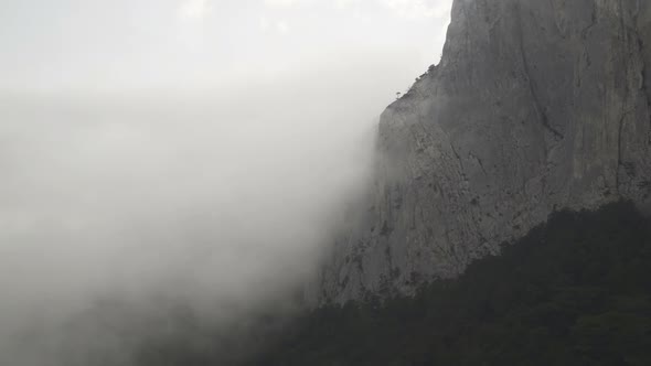 Majestical Mountains in Clouds, and Dramatic Fog