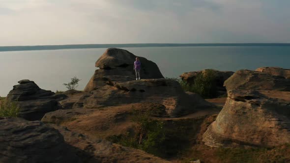 The Girl is Engaged in Fitness in Nature