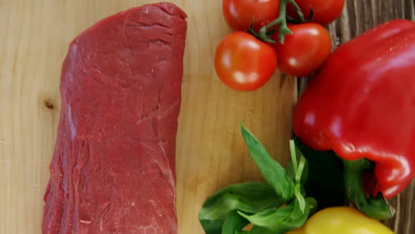 Sirloin meat loaf and ingredients on wooden board