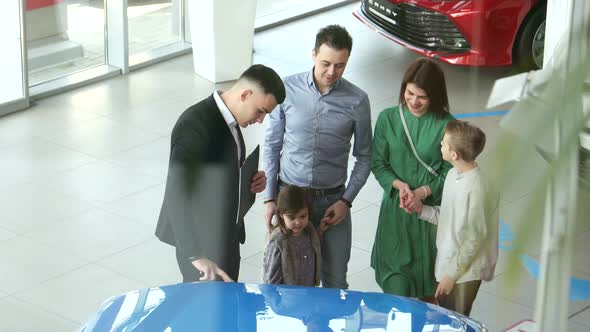 Mother Father and Child Buying Car at Dealership a New Family Auto