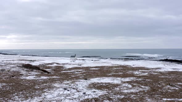 Lonely Church in Snowy Iceland on the Coast