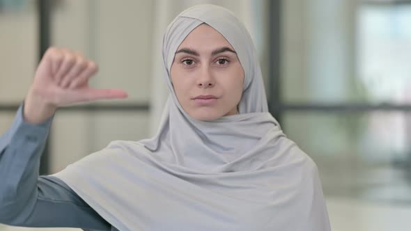 Thumbs Down Gesture By Young Arab Woman