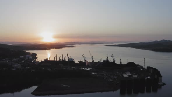 Cargo Cranes Working Early in the Morning at Dawn