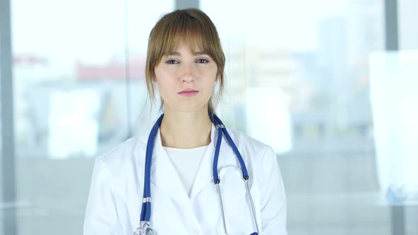 Portrait of Female Doctor Looking At Camera in Clinic