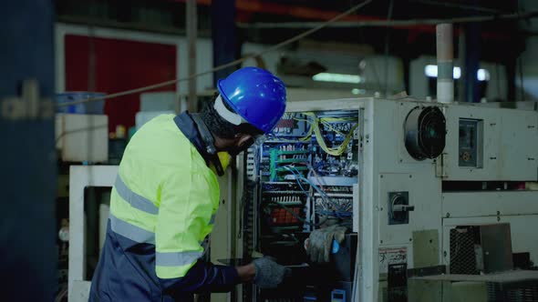 African American technician workers working in heavy industry , innovative industry standard,