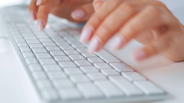 Female Hands Typing on a Computer Keyboard. Concept of Remote Work.