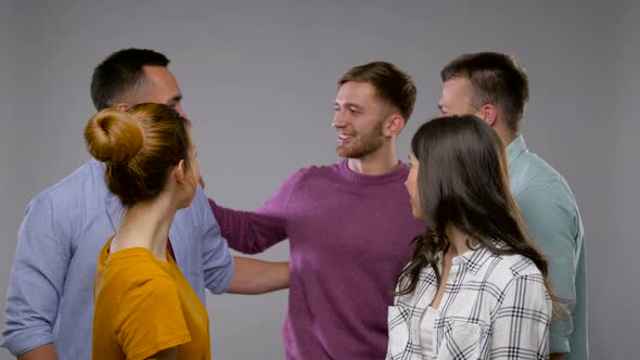 Group of Happy Smiling Friends Over Grey 