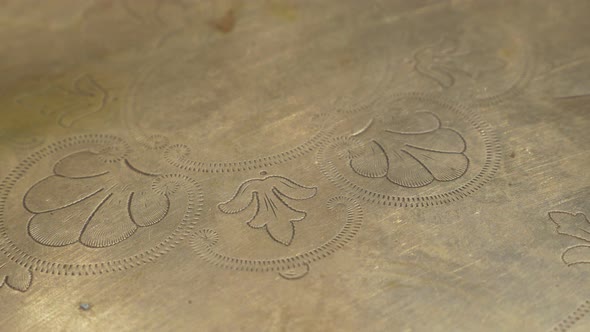 Ancient brass plate with beautiful texture in 4K UHD 2160p footage - Ancient hand made plate with be