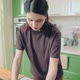 Young Caucasian Woman in Brown Tshirt Cooking at Home Kitchen - VideoHive Item for Sale