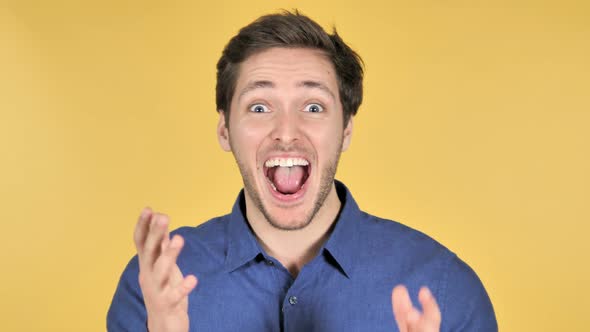 Surprised Man Isolated on Yellow Background
