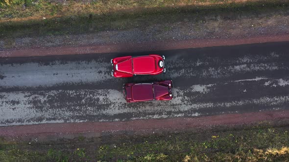 Top View Two Retro Cars are Driving in Different Directions on the Road