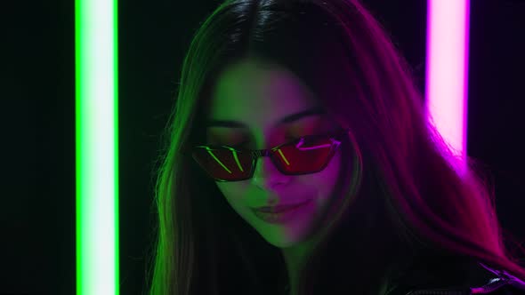 Portrait of a Pretty Young Beautiful Woman in Stylish Sunglasses Dancing While Enjoying the Music