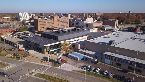 Rising forward aerial shot of streets and buildings in Muskegon, MI