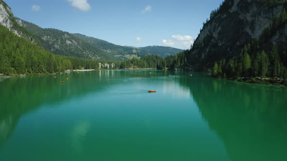 Aerial Footage Over Lake Braies Pragser Wildsee and Mountains in the Background on a Sunny Bright