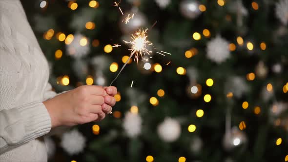 Woman with Sparkler at Christmas Party