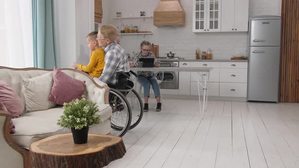 Disabled Granny Riding with Grandson in Wheelchair