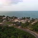 Van Driving On Road In Caribbean Beach Village Aerial Shot 4K - VideoHive Item for Sale
