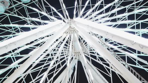 White Ferris Wheel at Amusement Park in the Night