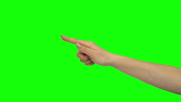 Arm of Female Indicating Two Items. Green Screen. Close Up