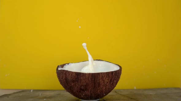 Splashes of Coconut Milk After Cubes of Tropical Fruits Being Dropped in It