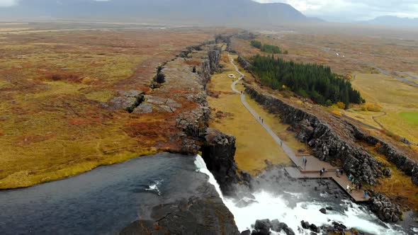 Aerial View Autumn Landscape in Iceland, Rocky Canyon with Waterfall, Thingvellir