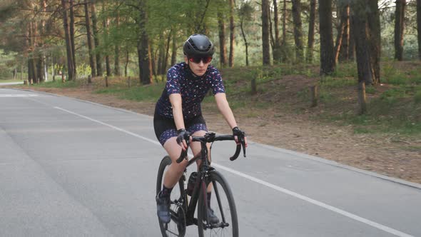 Woman rides bicycle