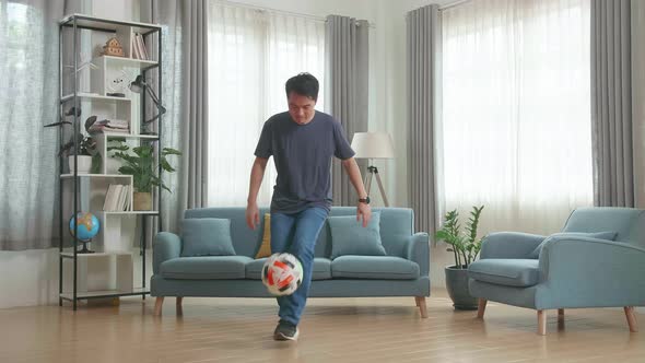 Asian Man Show Skill With Soccer Ball In Living Room, Soccer Freestyle