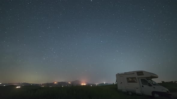 Time lapse: night sky landscape in Orcia Valley, Tuscany, Italy. The Milky Way galaxy and stars over