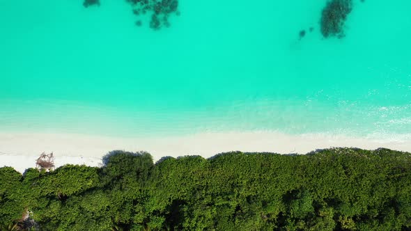 Beautiful aerial abstract shot of a paradise sunny white sand beach and aqua blue water background i