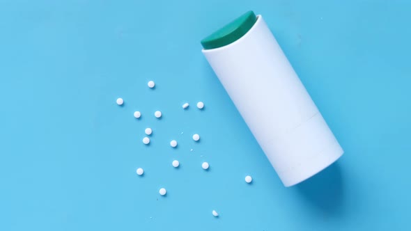 Artificial Sweetener Container on Blue Background