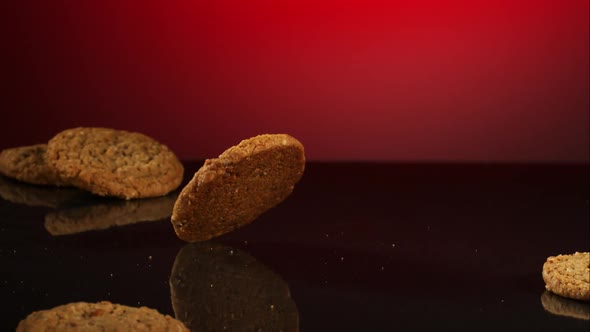 Cookies falling and bouncing in ultra slow motion 1500fps - reflective surface - COOKIES