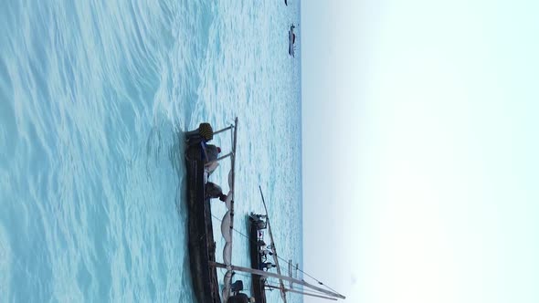 Vertical Video Boats in the Ocean Near the Coast of Zanzibar Tanzania Aerial View