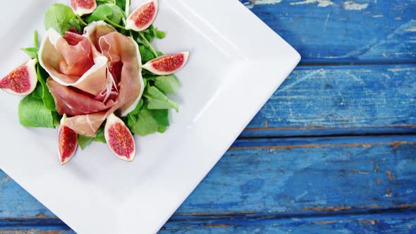 Raw meat and vegetables decorated on plate