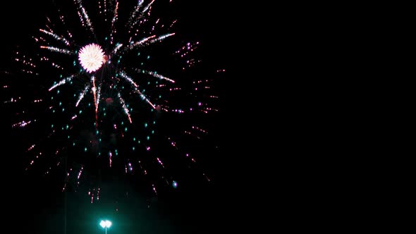 Close up of bright festive fireworks in nighttime.