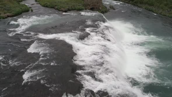 Flight over a rapid  waterfall in Iceland