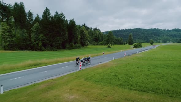 Team of Cyclists Ride in Beautiful Scenery