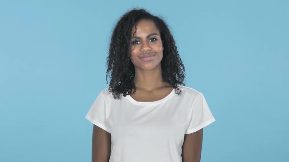 Yes African Girl Shaking Head to Accept Isolated on Blue Background