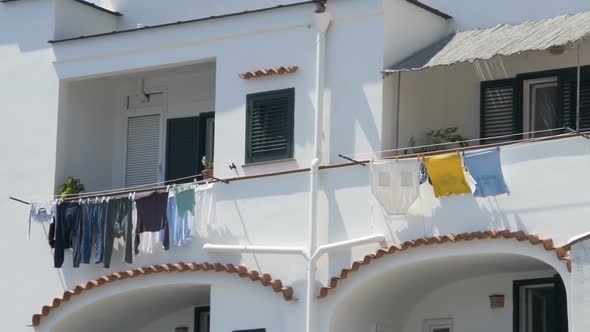 Balconies of Neighboring Apartments at Residential House, Laundry Drying in Wind