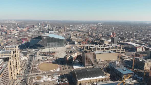 Aerial footage of Minneapolis, camera tilting down, us bank stadium