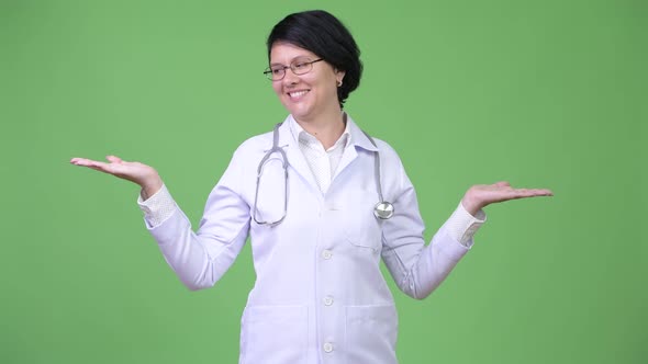 Beautiful Woman Doctor with Short Hair Comparing