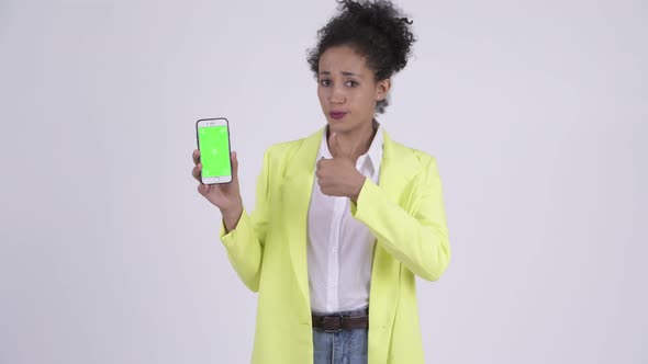 Happy Young Beautiful African Businesswoman Showing Phone and Giving Thumbs Up