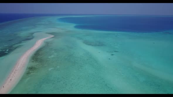 Aerial top down scenery of luxury lagoon beach lifestyle by blue green water and white sandy backgro