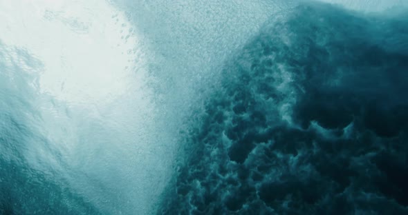 Looking up at a breaking wave from below