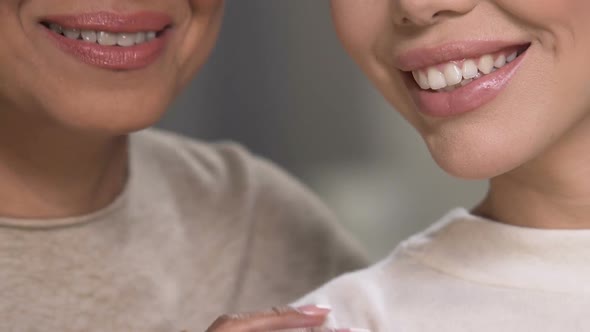 Happy mother and daughter smiling closeup, support in family, close relations