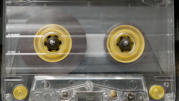 Playing  cassette in retro  casettophone  4K 2160p 30fps UltraHD footage - Supply spindle rotation o