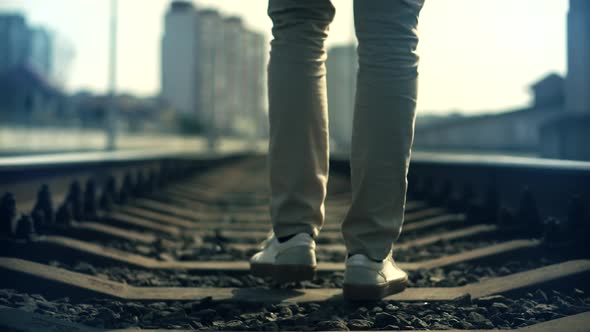 Businessman Feet In Pants Walking On Rail Road When Train Or Tram Cancelled. Legs Walking On Railway