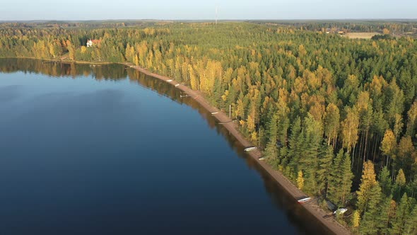 The Aerial View of the Trees on the Side of Lake Saimaa in Finland
