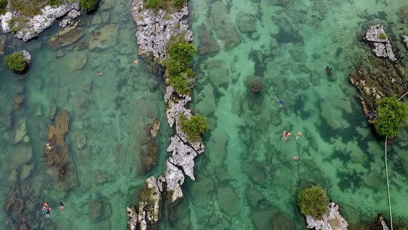 Drone shot of clear water lagoon in the south of Mexico at Yal-Ku, Akumal