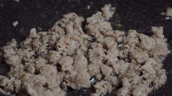 Chef stir fry minced meat in a Frying pan. Frying minced meat in a pan